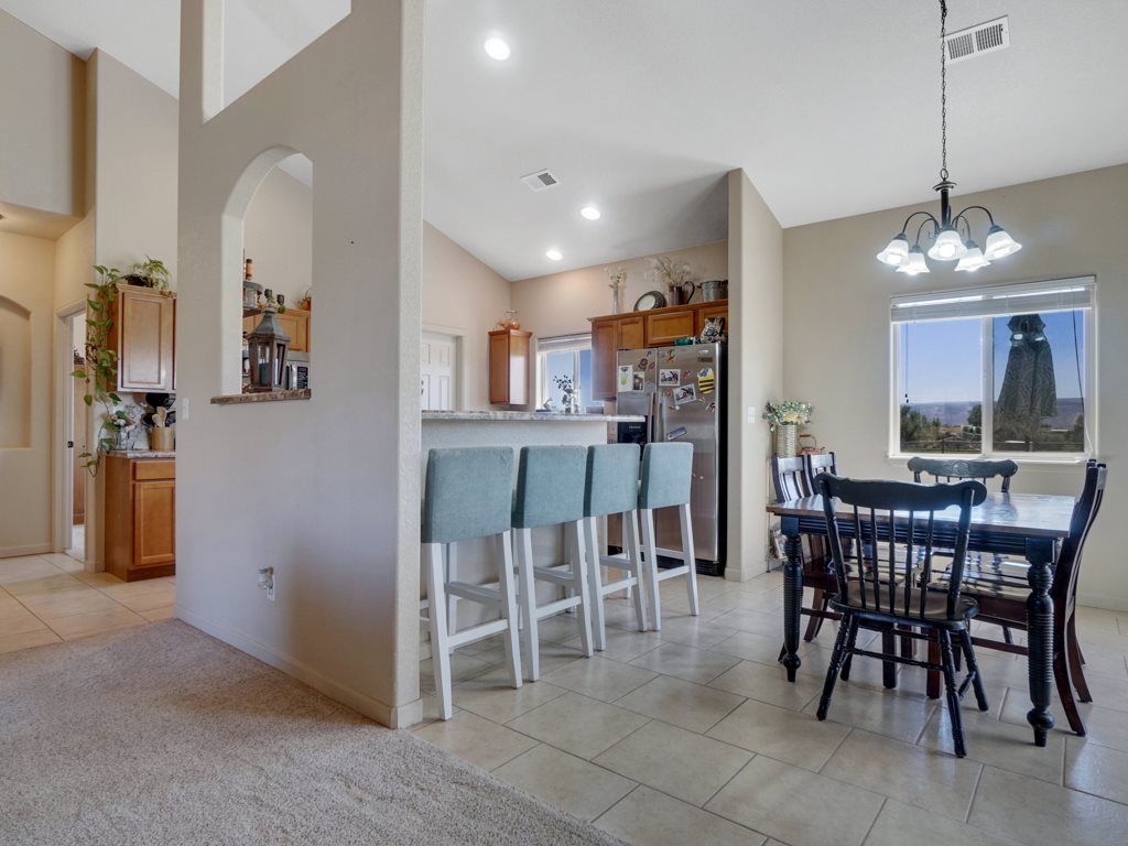 1855 Golden Ranch Road Fruita, CO 81521 - Photo 23 of 24 a view of a dining room with furniture and chandelier