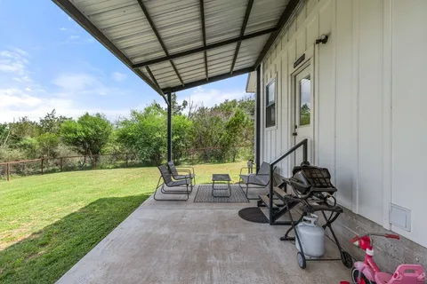 a view of swimming pool with a patio