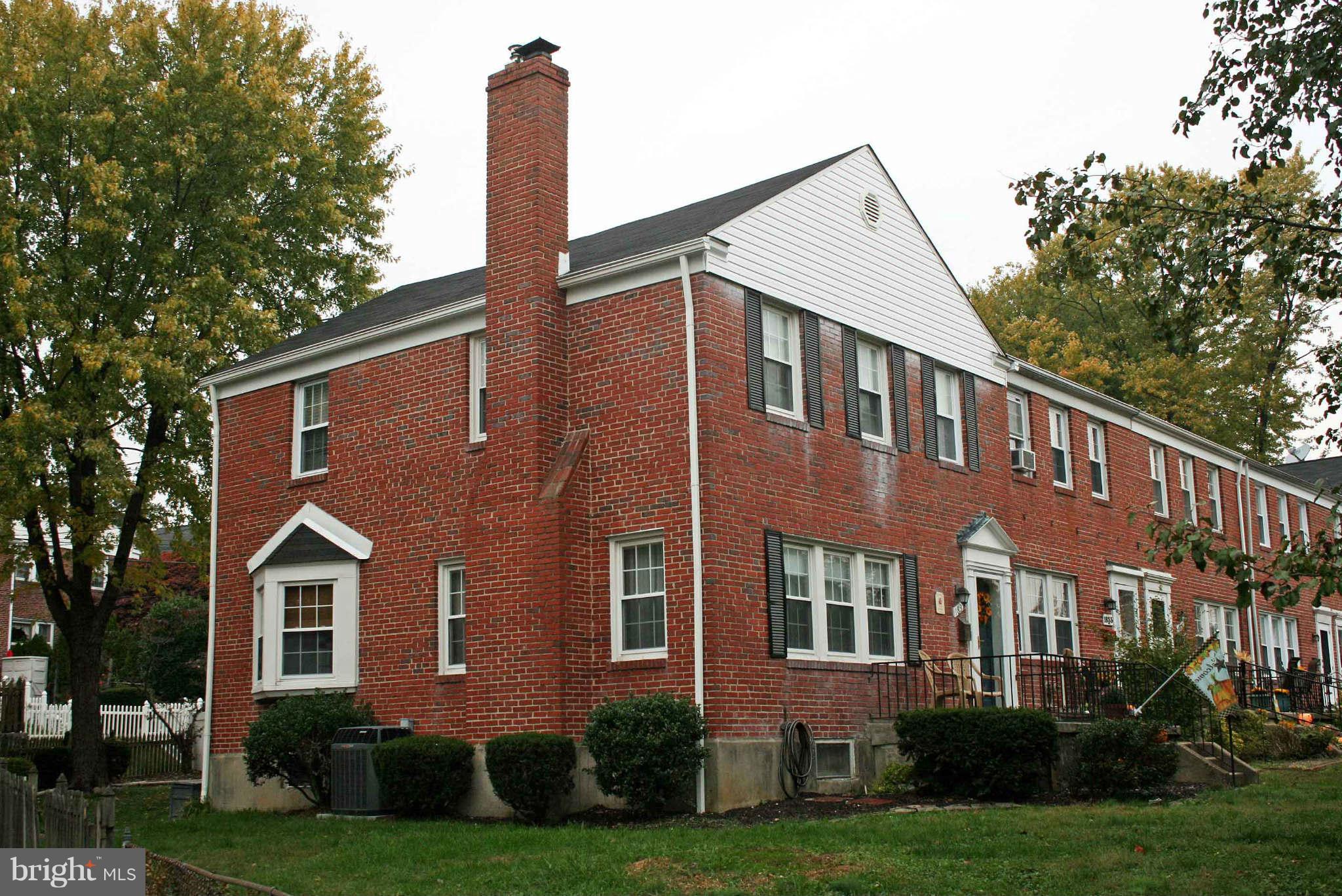 1835 Glen Ridge Road Baltimore, MD 21286 - Photo 2 of 30 a front view of a house with a yard and many windows