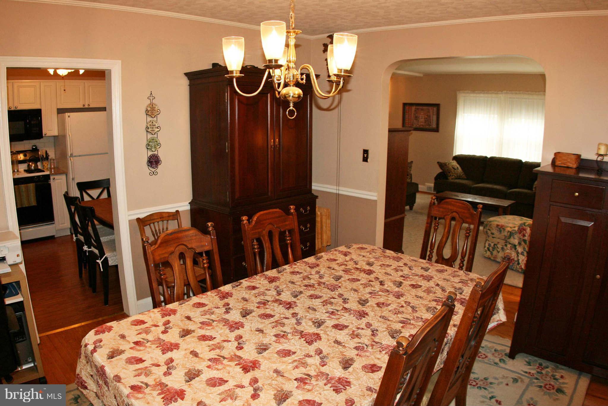 1835 Glen Ridge Road Baltimore, MD 21286 - Photo 12 of 30 a bed room with a bed a dresser and mirror