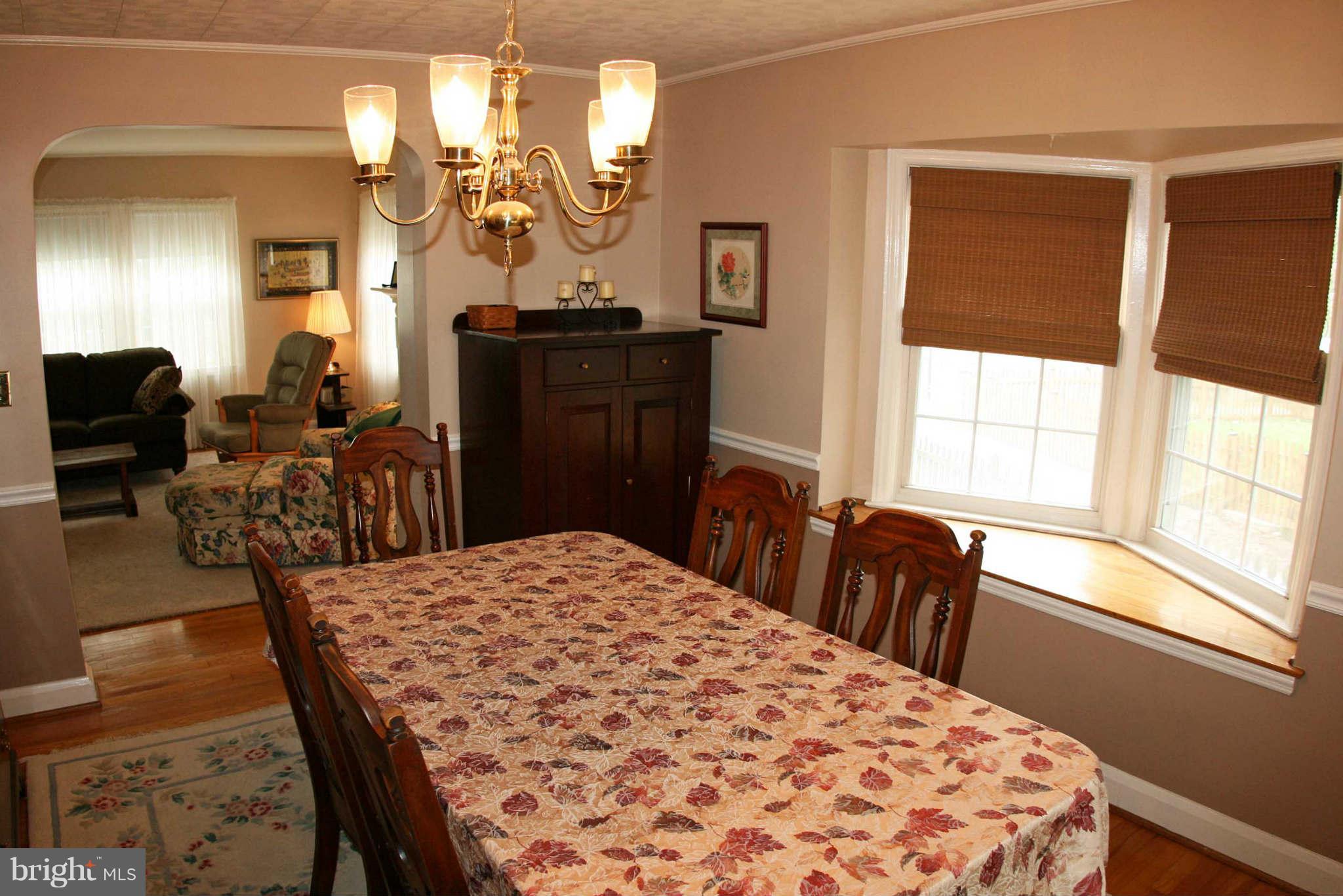 1835 Glen Ridge Road Baltimore, MD 21286 - Photo 13 of 30 a bedroom with a bed a dresser and chair