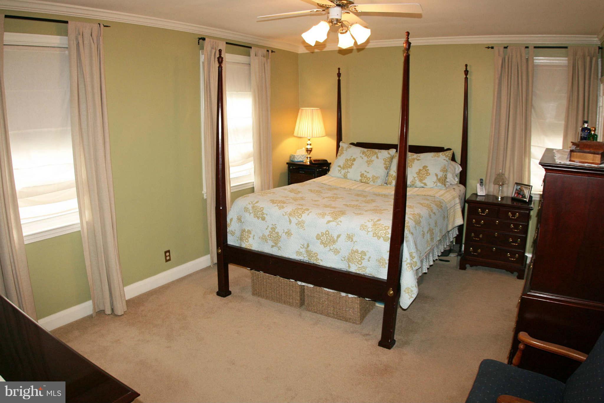 1835 Glen Ridge Road Baltimore, MD 21286 - Photo 14 of 30 a bedroom with a bed and a mirror