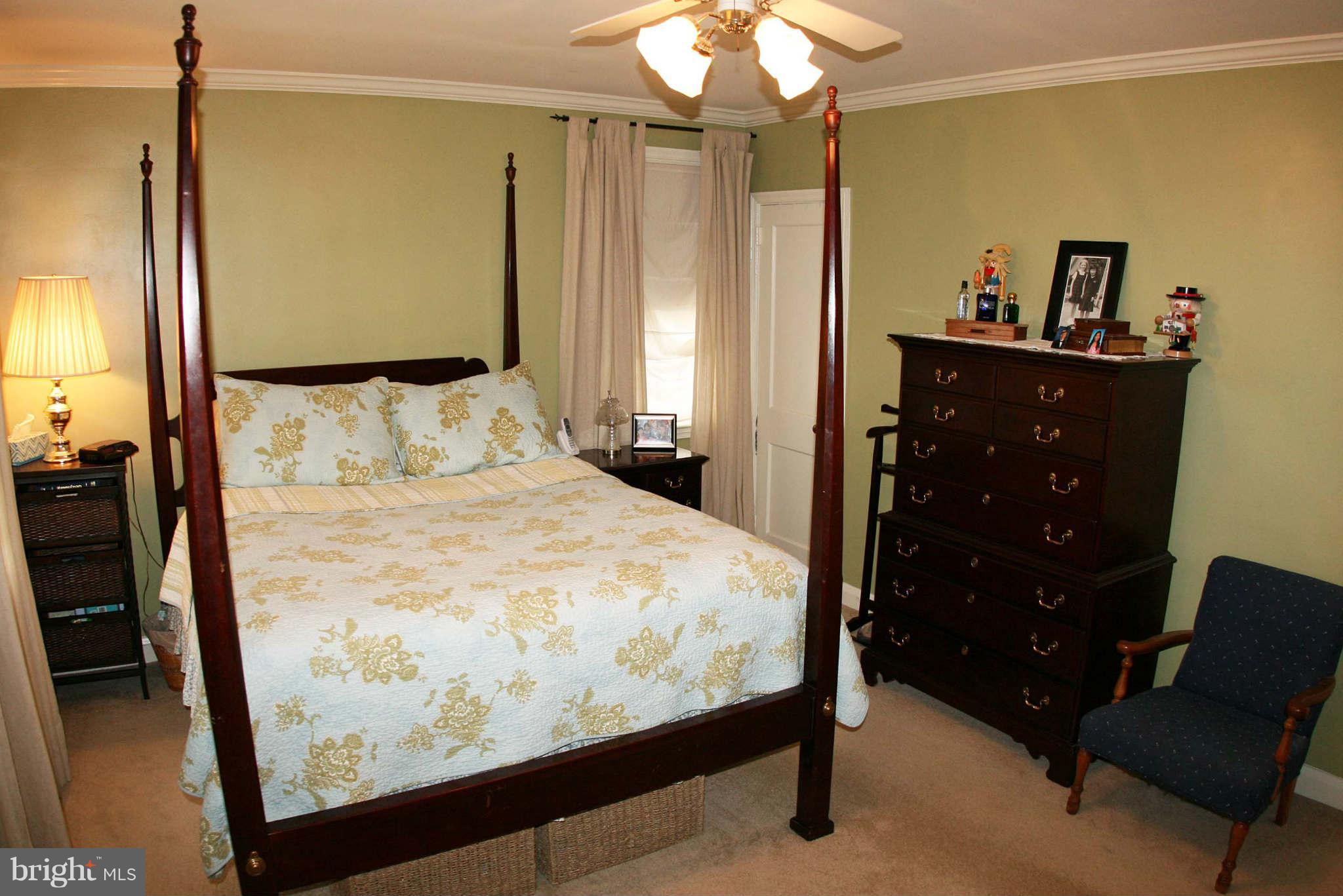 1835 Glen Ridge Road Baltimore, MD 21286 - Photo 15 of 30 a bedroom with a bed and a dresser
