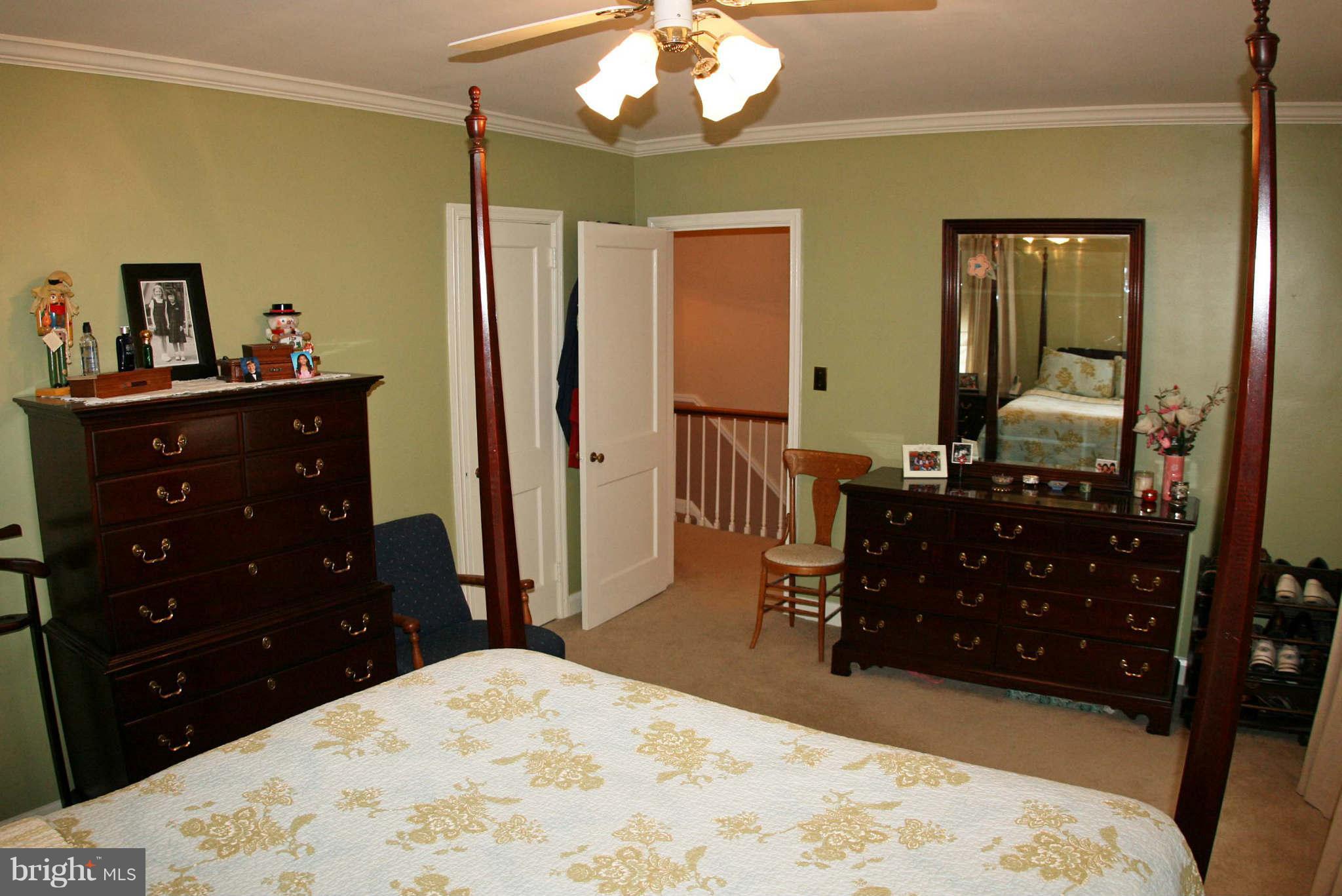 1835 Glen Ridge Road Baltimore, MD 21286 - Photo 16 of 30 a bedroom with a bed and a dresser in it