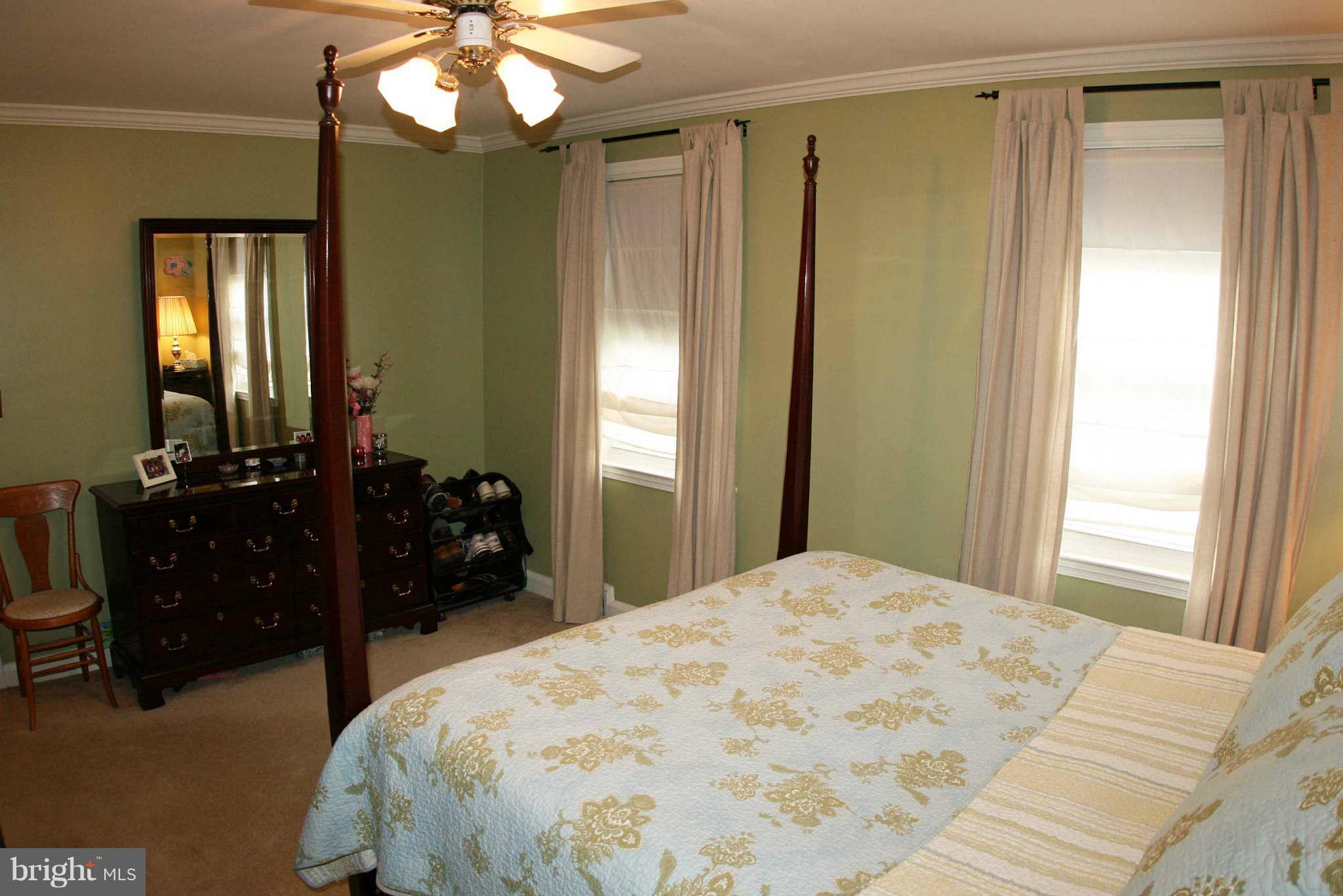 1835 Glen Ridge Road Baltimore, MD 21286 - Photo 17 of 30 a bedroom with a bed and a mirror