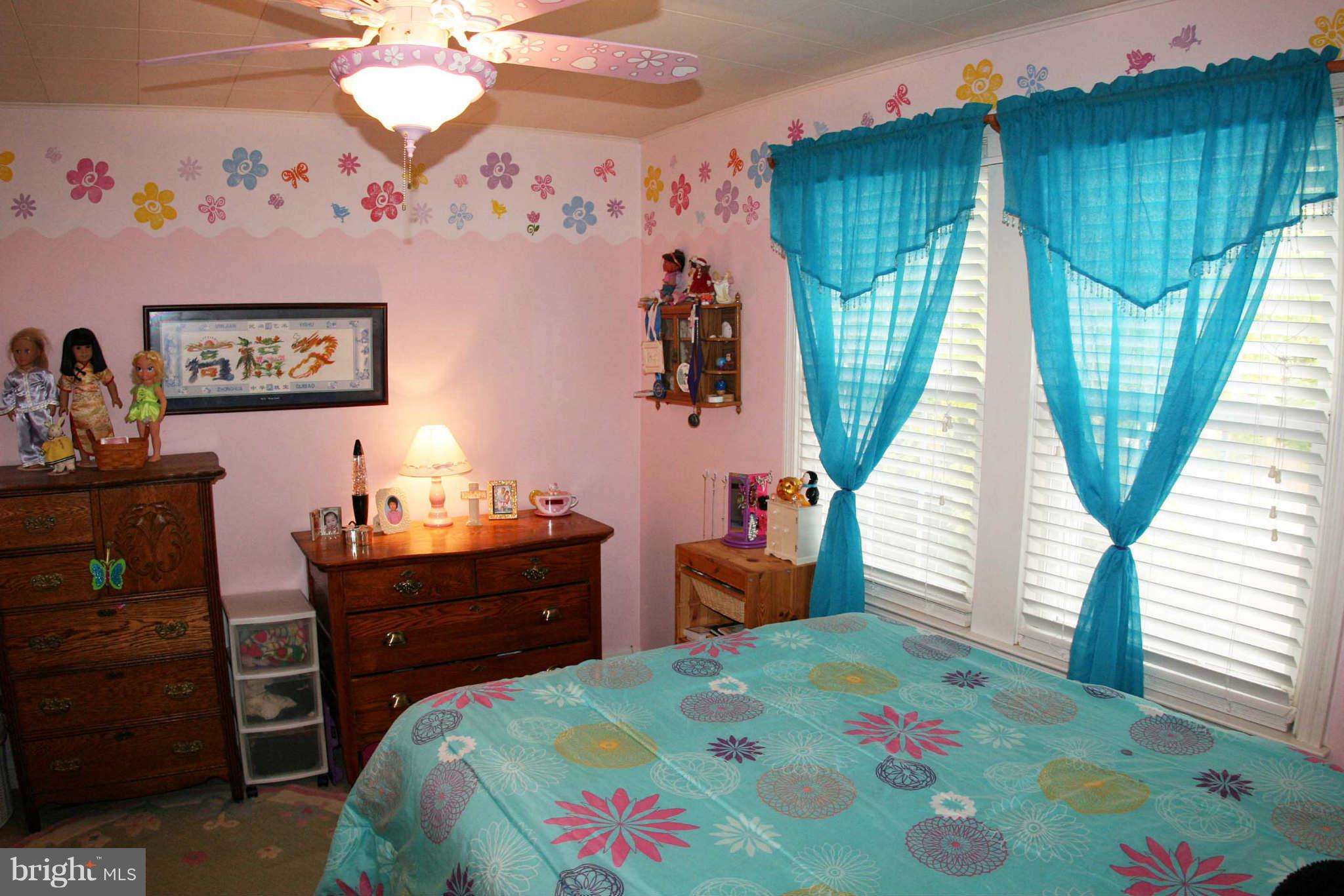 1835 Glen Ridge Road Baltimore, MD 21286 - Photo 19 of 30 a bedroom with a bed and a dresser in it