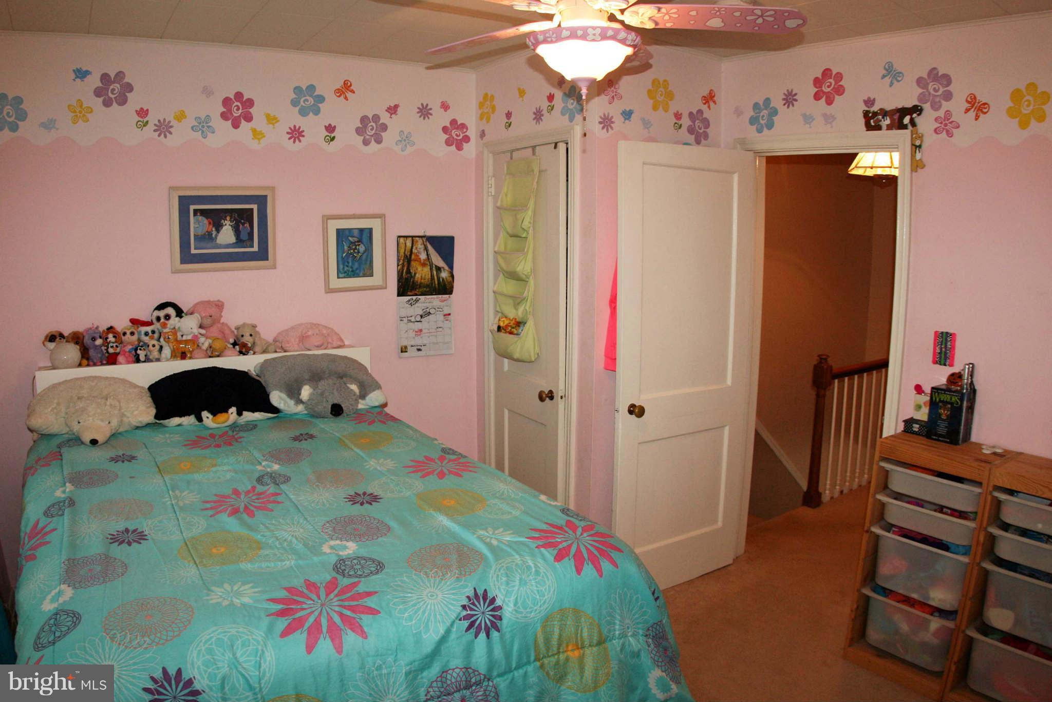 1835 Glen Ridge Road Baltimore, MD 21286 - Photo 20 of 30 a bedroom with a bed and a dresser