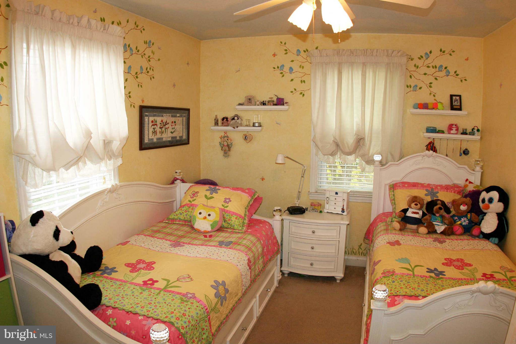 1835 Glen Ridge Road Baltimore, MD 21286 - Photo 21 of 30 a bedroom with a bed and a chandelier