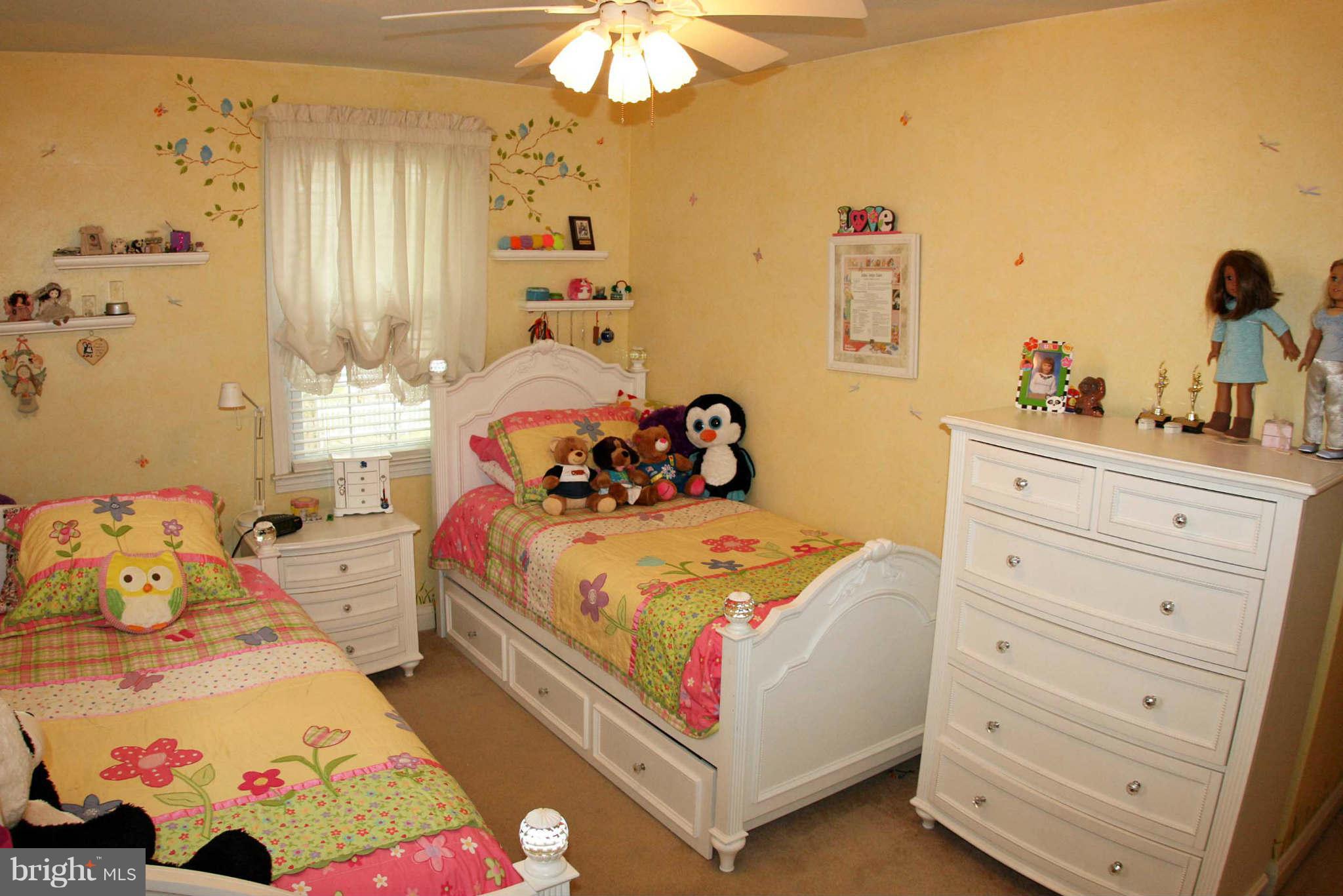 1835 Glen Ridge Road Baltimore, MD 21286 - Photo 22 of 30 a bedroom with a bed and a dresser in it