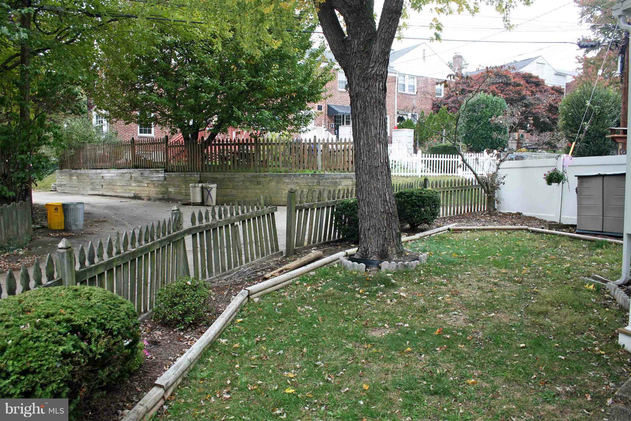 1835 Glen Ridge Road Baltimore, MD 21286 - Photo 30 of 30 a view of a park that has large trees and a wooden fence