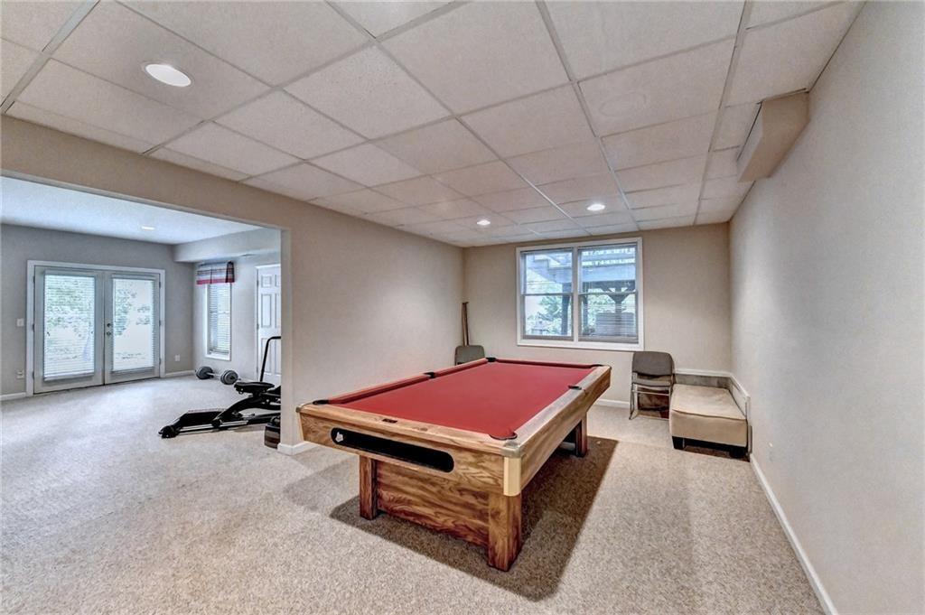 1595 Chadberry Way Lawrenceville, GA 30043 - Photo 19 of 47 a room with pool table and windows