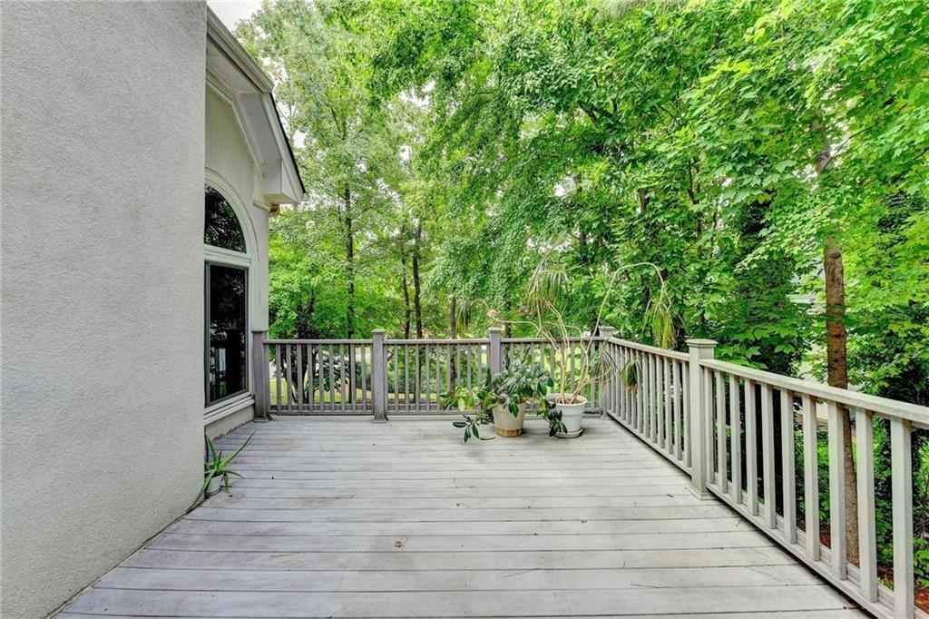 1595 Chadberry Way Lawrenceville, GA 30043 - Photo 20 of 47 a balcony with view of trees in the background
