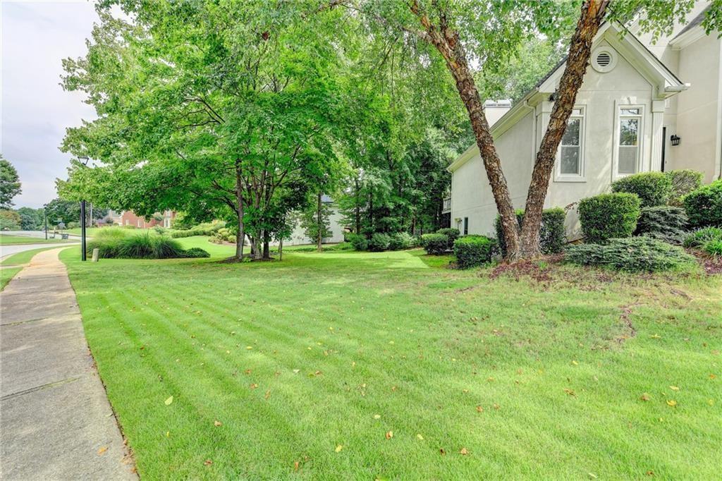 1595 Chadberry Way Lawrenceville, GA 30043 - Photo 22 of 47 a view of a house with backyard and garden