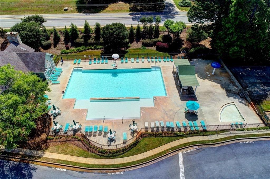 1595 Chadberry Way Lawrenceville, GA 30043 - Photo 28 of 47 a view of swimming pool in a backyard