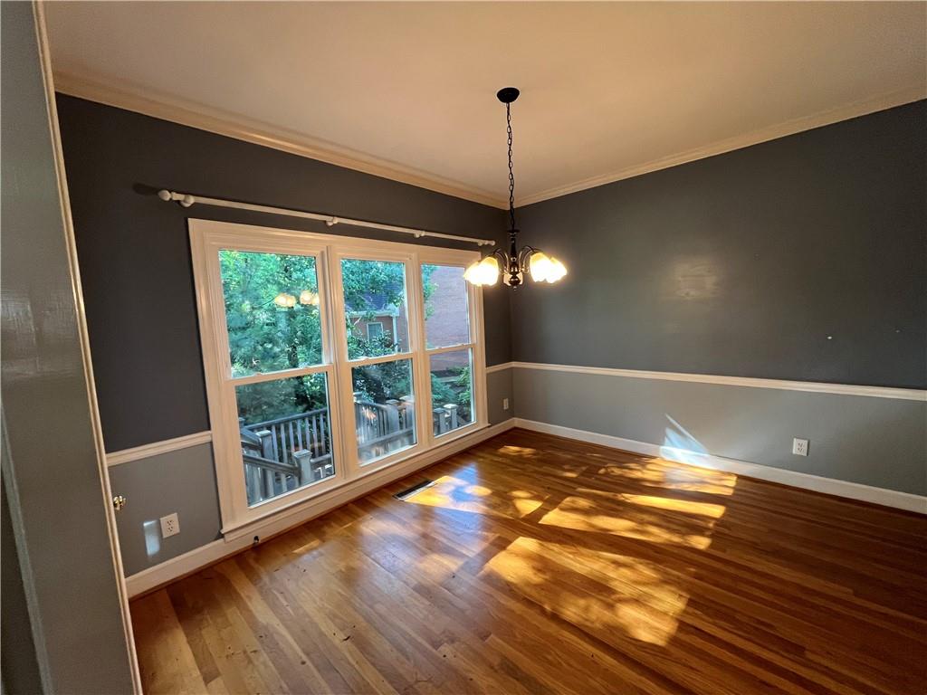 1595 Chadberry Way Lawrenceville, GA 30043 - Photo 32 of 47 a view of empty room with wooden floor and fan
