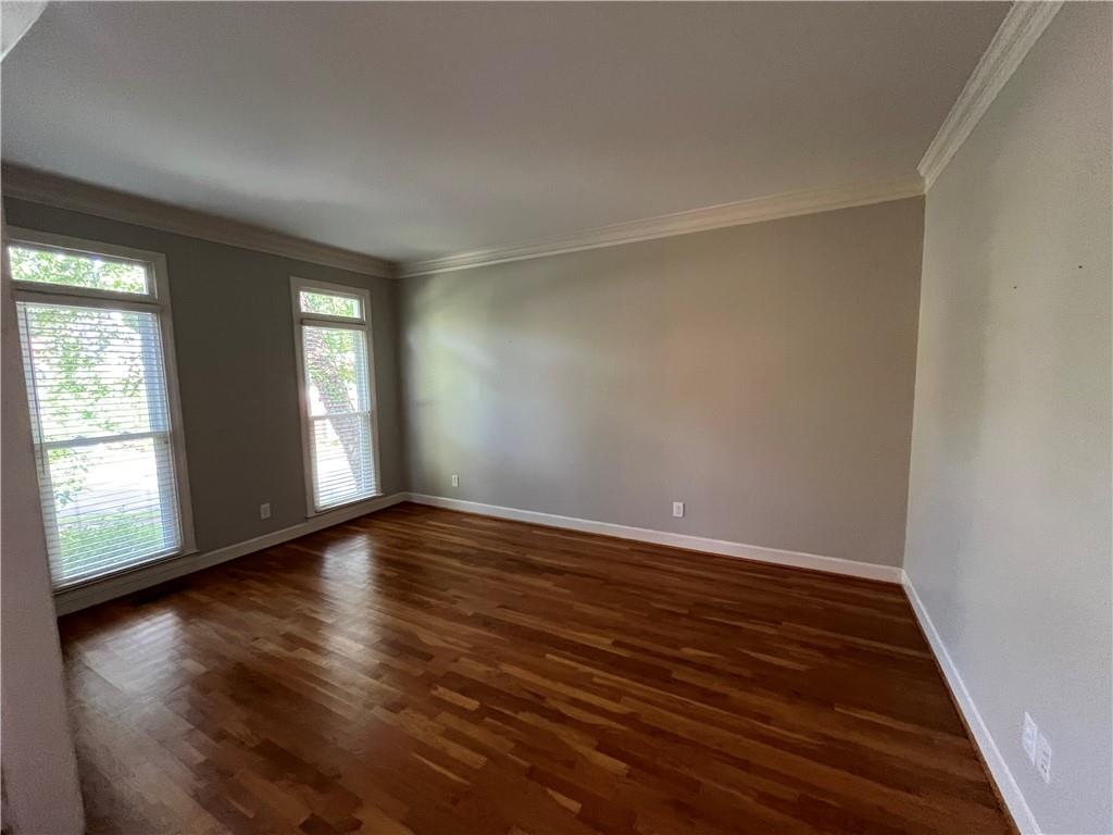 1595 Chadberry Way Lawrenceville, GA 30043 - Photo 34 of 47 a view of an empty room with wooden floor and window
