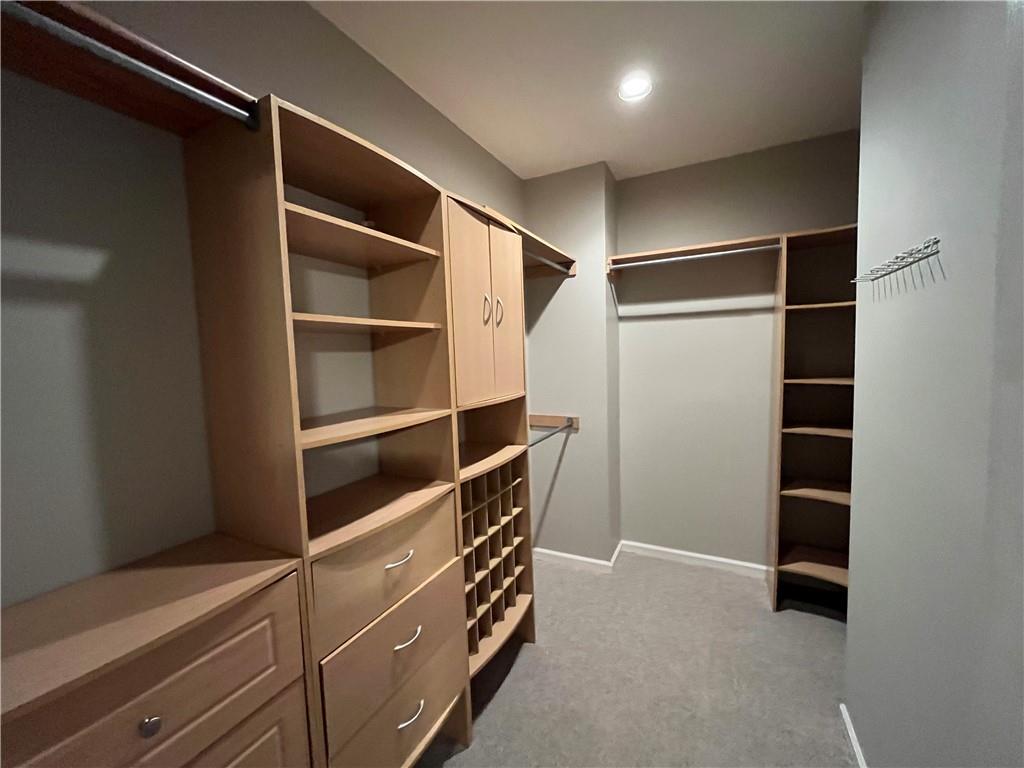 1595 Chadberry Way Lawrenceville, GA 30043 - Photo 39 of 47 a view of walk in closet with empty racks
