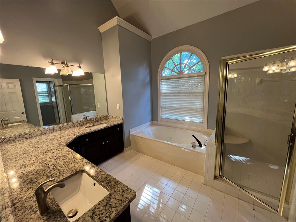 1595 Chadberry Way Lawrenceville, GA 30043 - Photo 40 of 47 a spacious bathroom with a double vanity sink and a mirror