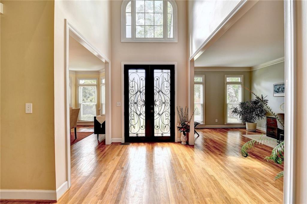 1595 Chadberry Way Lawrenceville, GA 30043 - Photo 4 of 47 a view of a room with wooden floor and furniture