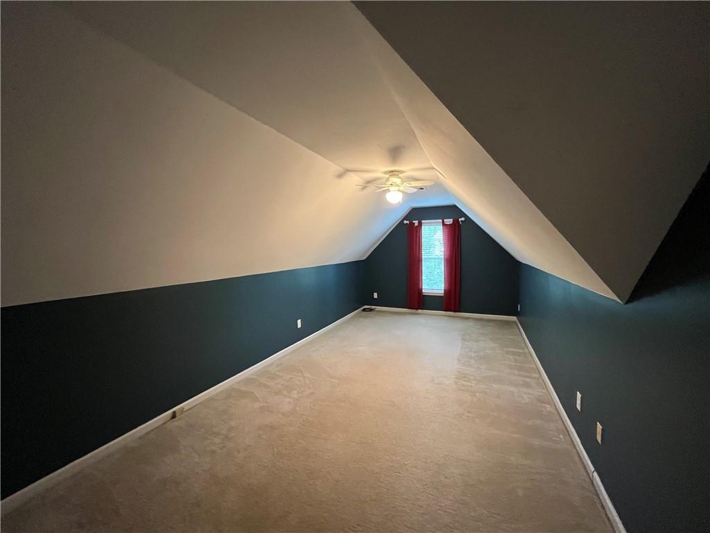 1595 Chadberry Way Lawrenceville, GA 30043 - Photo 43 of 47 a view of an empty room with wooden floor