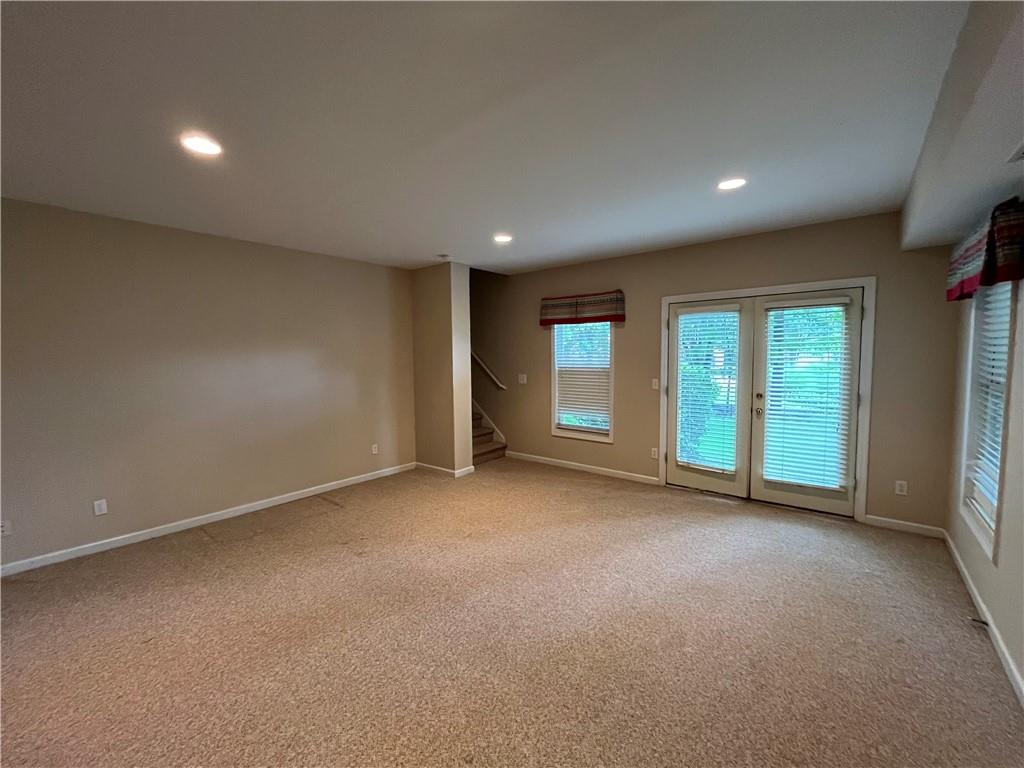 1595 Chadberry Way Lawrenceville, GA 30043 - Photo 45 of 47 a view of a livingroom with an empty space and window