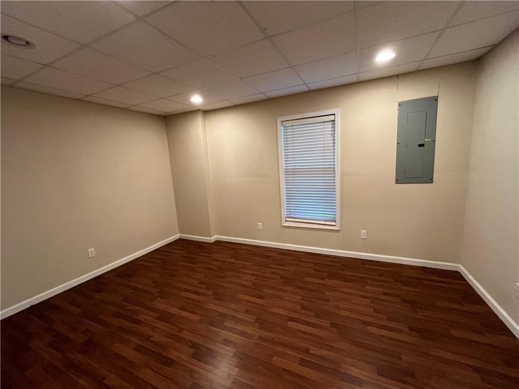 1595 Chadberry Way Lawrenceville, GA 30043 - Photo 47 of 47 a view of an empty room with wooden floor and a window