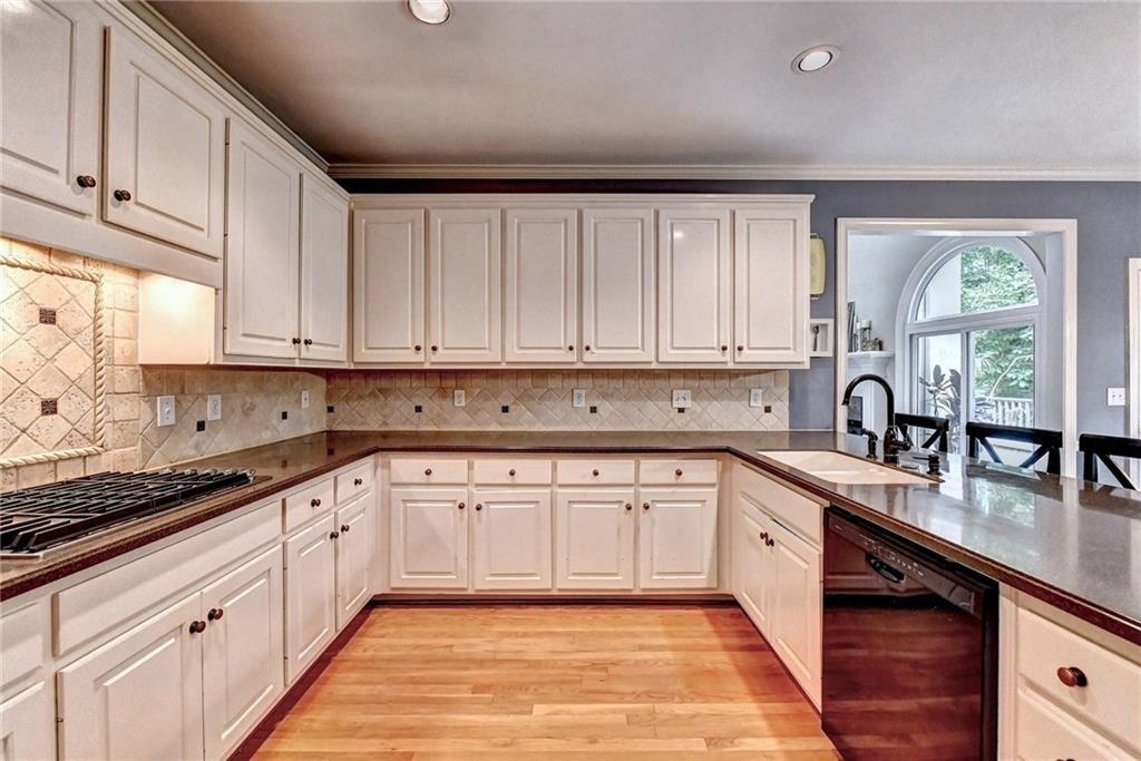 1595 Chadberry Way Lawrenceville, GA 30043 - Photo 6 of 47 a kitchen with sink cabinets and window