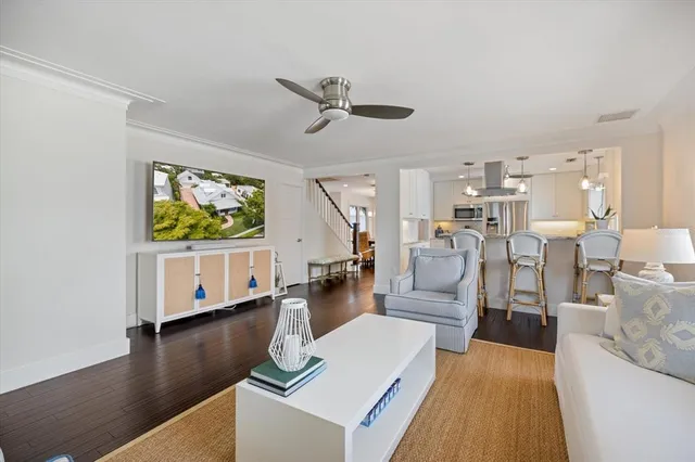 a spacious bathroom with a granite countertop sink a toilet and a mirror