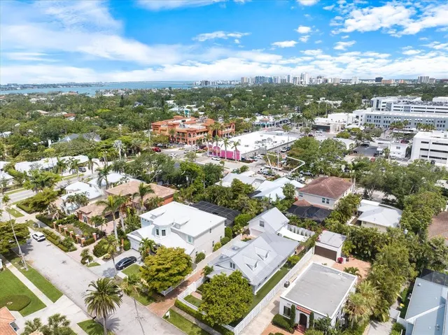 a view of a living room with furniture and a chandelier