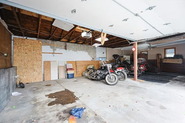 a view of a garage with parked cars