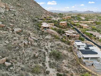 a view of a mountain with mountains in the background