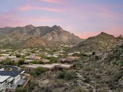 a aerial view of a house with a yard