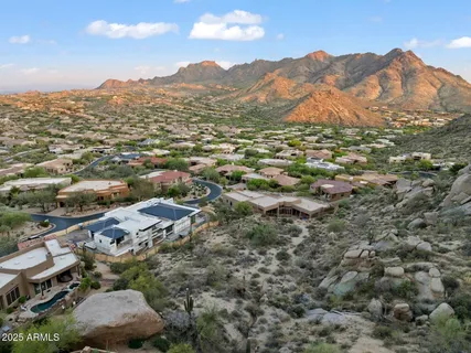 a view of a mountain in the distance in a field