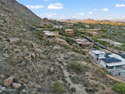 an aerial view of a house with outdoor space