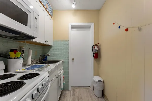 a kitchen with a stove and a microwave