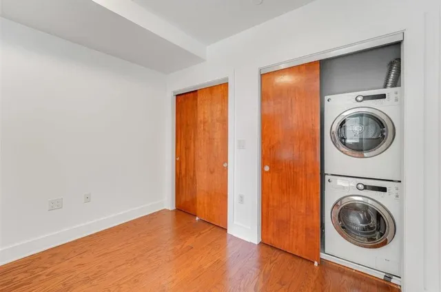 a view of a hallway with washer and dryer
