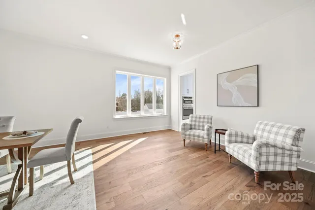 a kitchen with white cabinets appliances and a sink