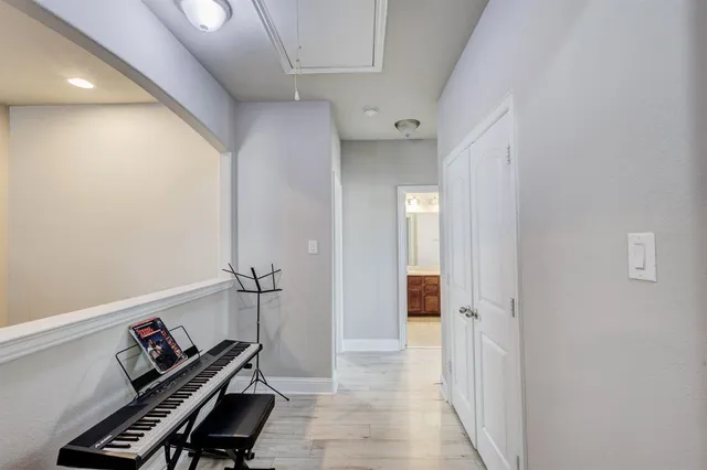 a view of a hallway with bathroom