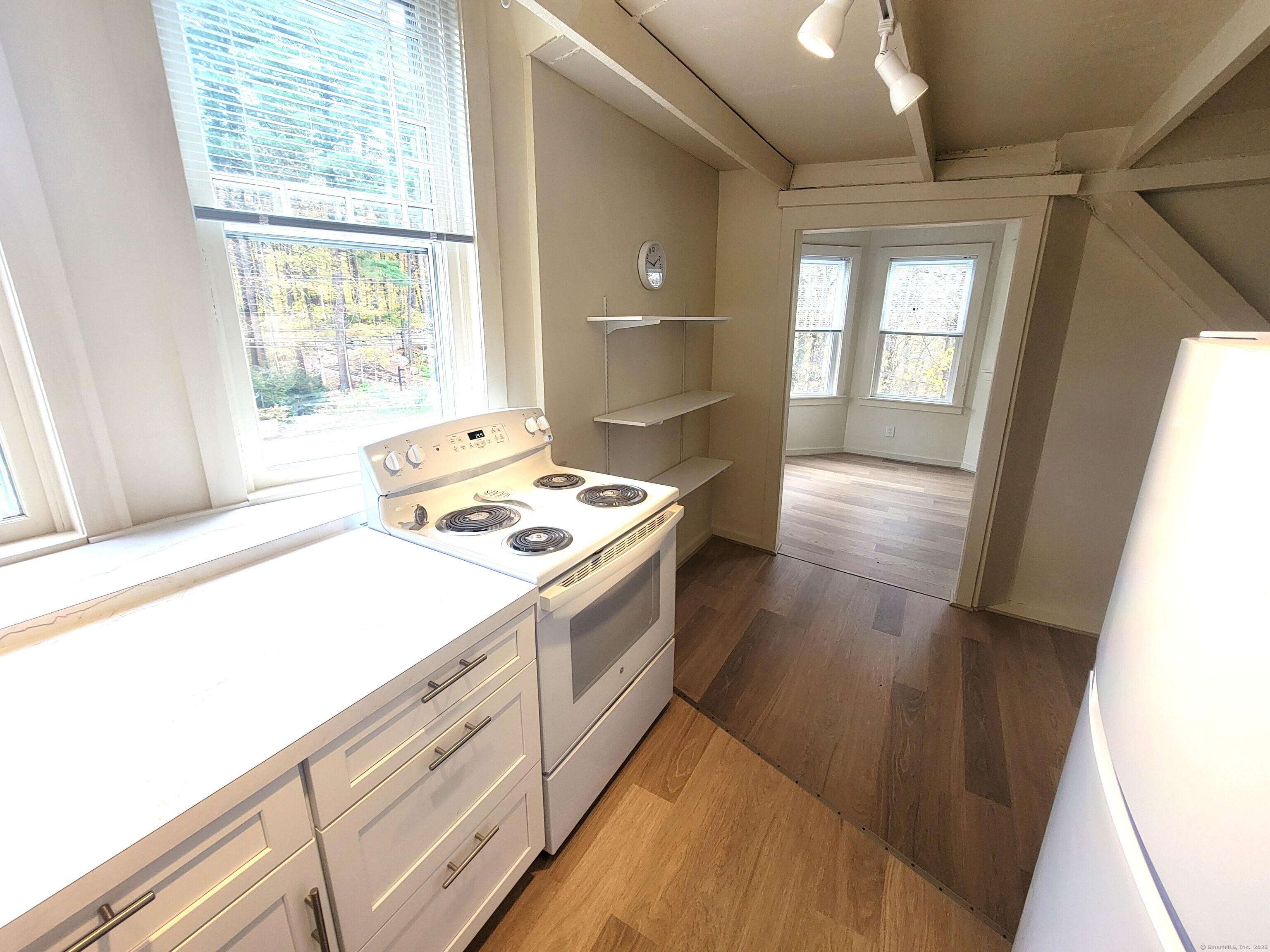 270 Cherry Brook Road, Unit 3 Canton, CT 06019 - Photo 8 of 18 a kitchen with kitchen island a stove a sink and a window