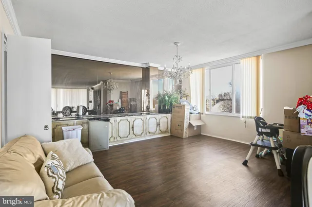 a large white kitchen with cabinets a sink and a dishwasher