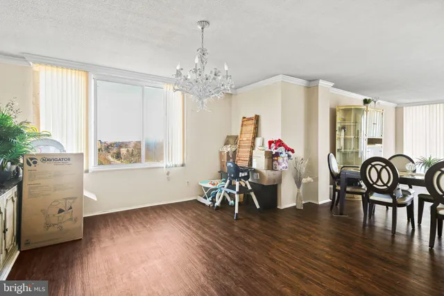 a kitchen with a sink a stove and a washer dryer