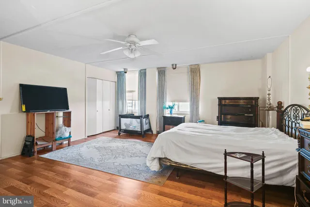 a view of a livingroom with a furniture wooden floor and window