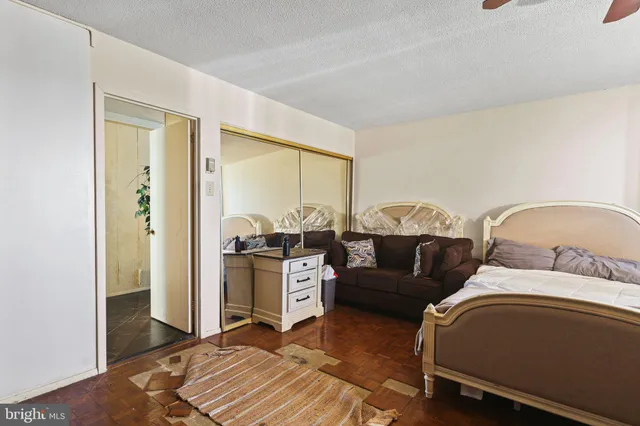 a view of a city from a balcony with furniture