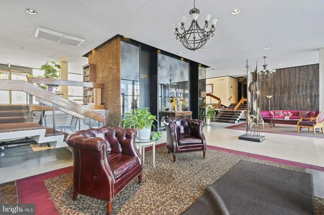 a lobby with furniture and rug