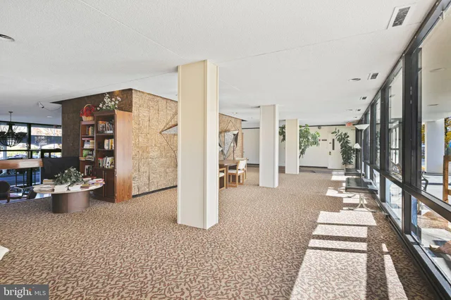 a outdoor space with lots of chairs and mirrors