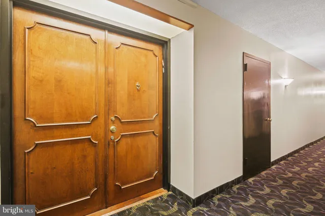 a bathroom with a toilet and a mirror