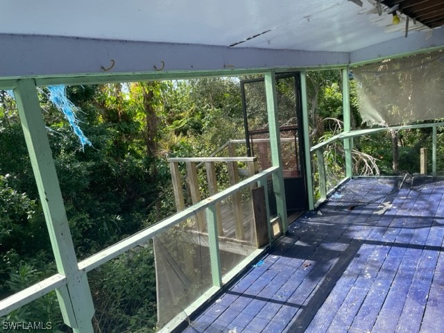 6670 Sun Rise Lane Bokeelia, FL 33922 - Photo 11 of 13 a view of a balcony with wooden floor