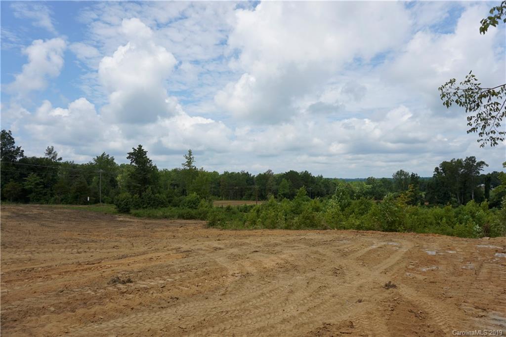 5-ac Boheler Road, Unit LOT 4 Clover, SC 29710 - Photo 8 of 9 a view of a field with trees in the background