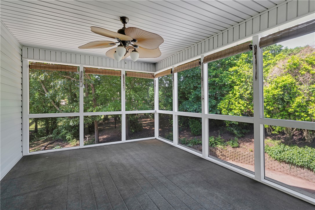 406 Hopewell Ridge Anderson, SC 29621 - Photo 25 of 46 This airy screened porch offers serene views of lush greenery, perfect for relaxed outdoor living.