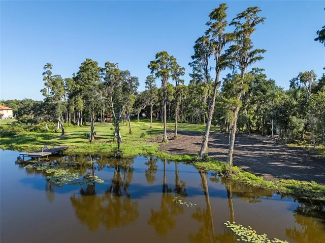 a view of a lake with a yard